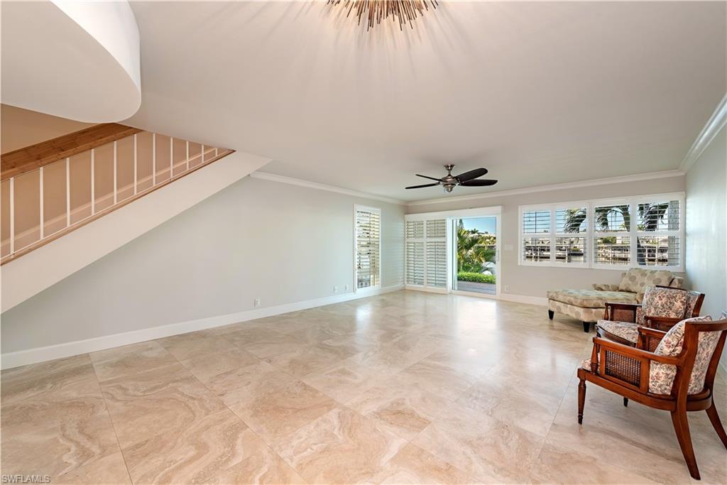 800 River Point Drive, Unit 207 Naples, FL 34102 - Photo 2 of 12 a view of livingroom with furniture window and outside view
