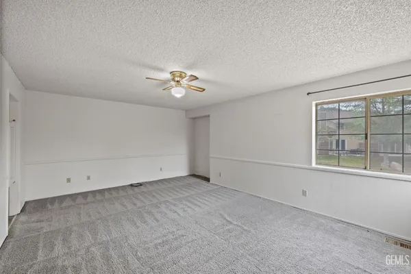 an aerial view of a houses with a yard