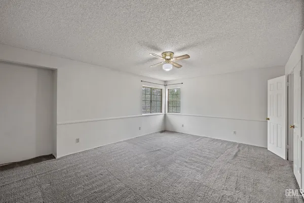 an aerial view of a houses with a yard