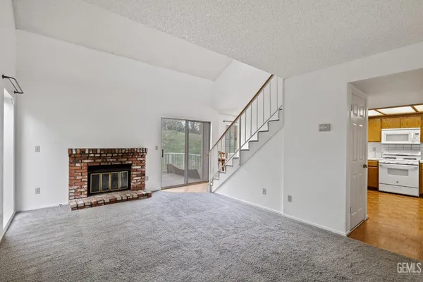 a view of an empty room with stairs