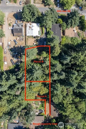 an aerial view of a houses with yard