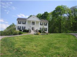 142 Lake Wood Road Lebanon, TN 37087 - Photo 1 of 1 a front view of a house with a yard and trees