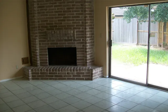 a view of a backyard with wooden fence