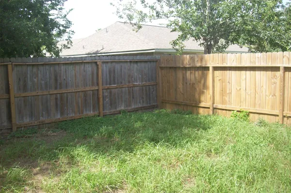 a room with a window and a fan