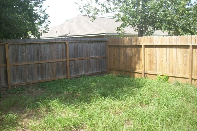 a room with a window and a fan