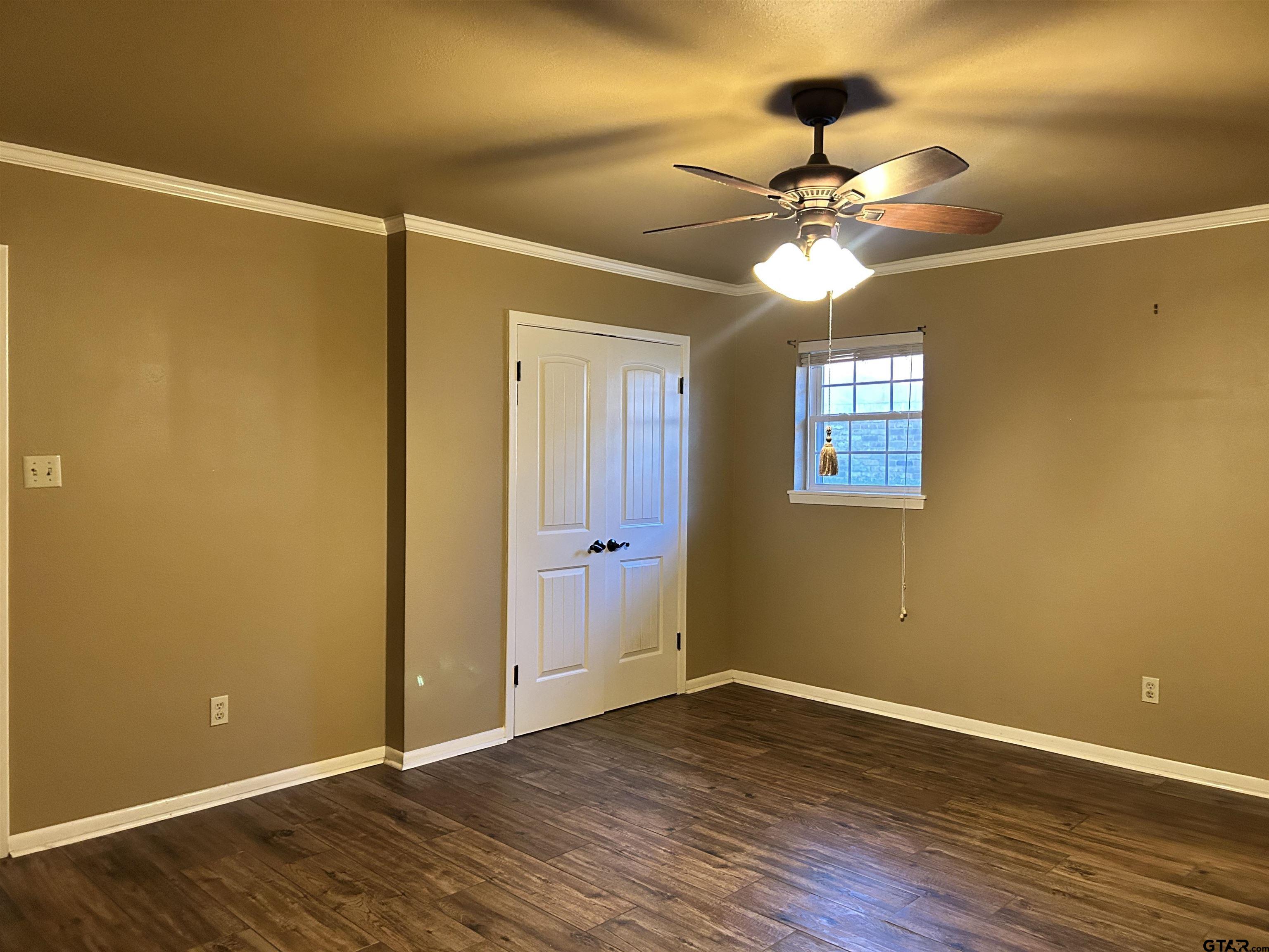 809 David Drive Tyler, TX 75703 - Photo 5 of 18 a view of a room with wooden floor closet and chandelier fan