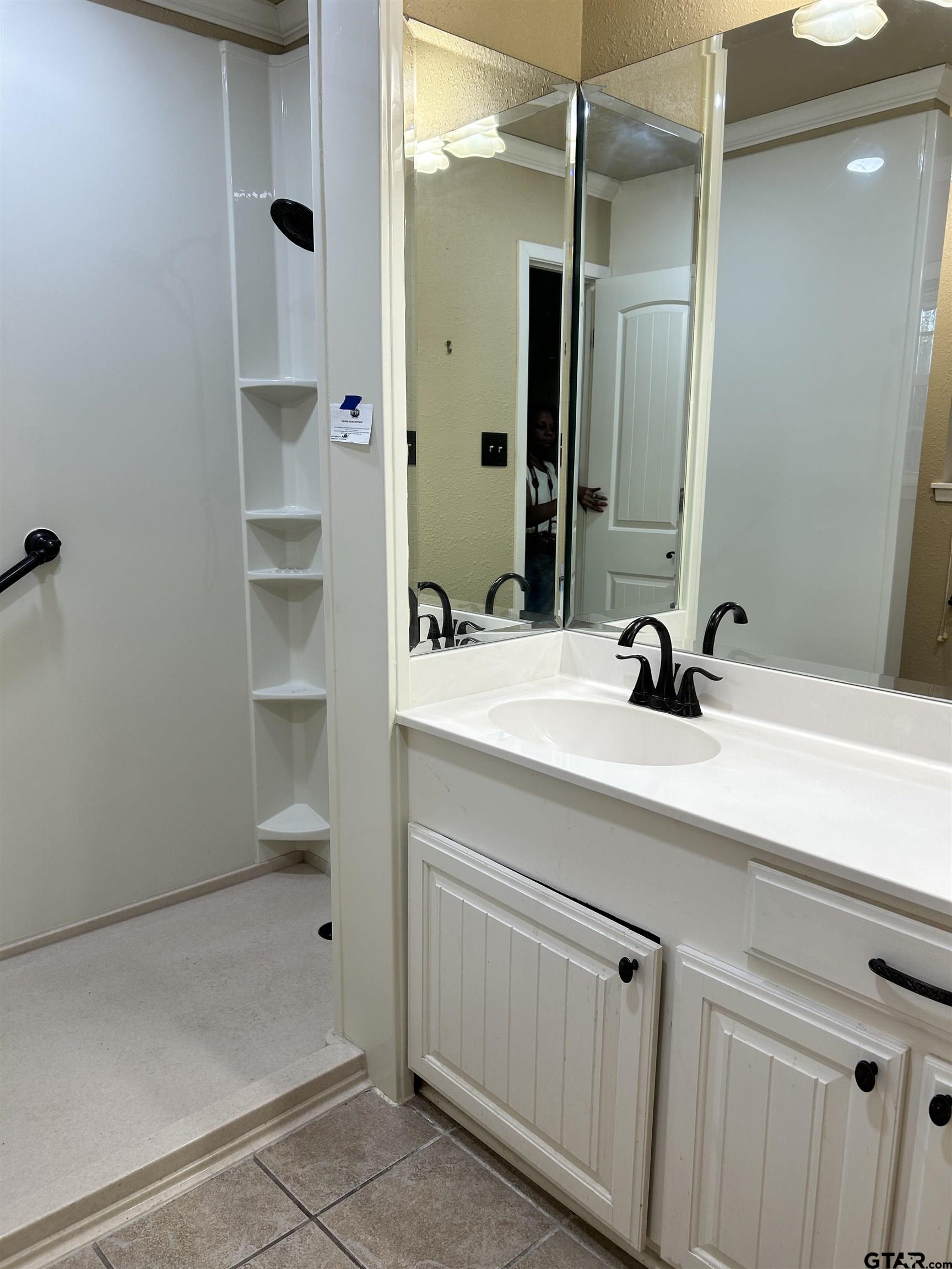 809 David Drive Tyler, TX 75703 - Photo 6 of 18 a bathroom with a sink and a mirror