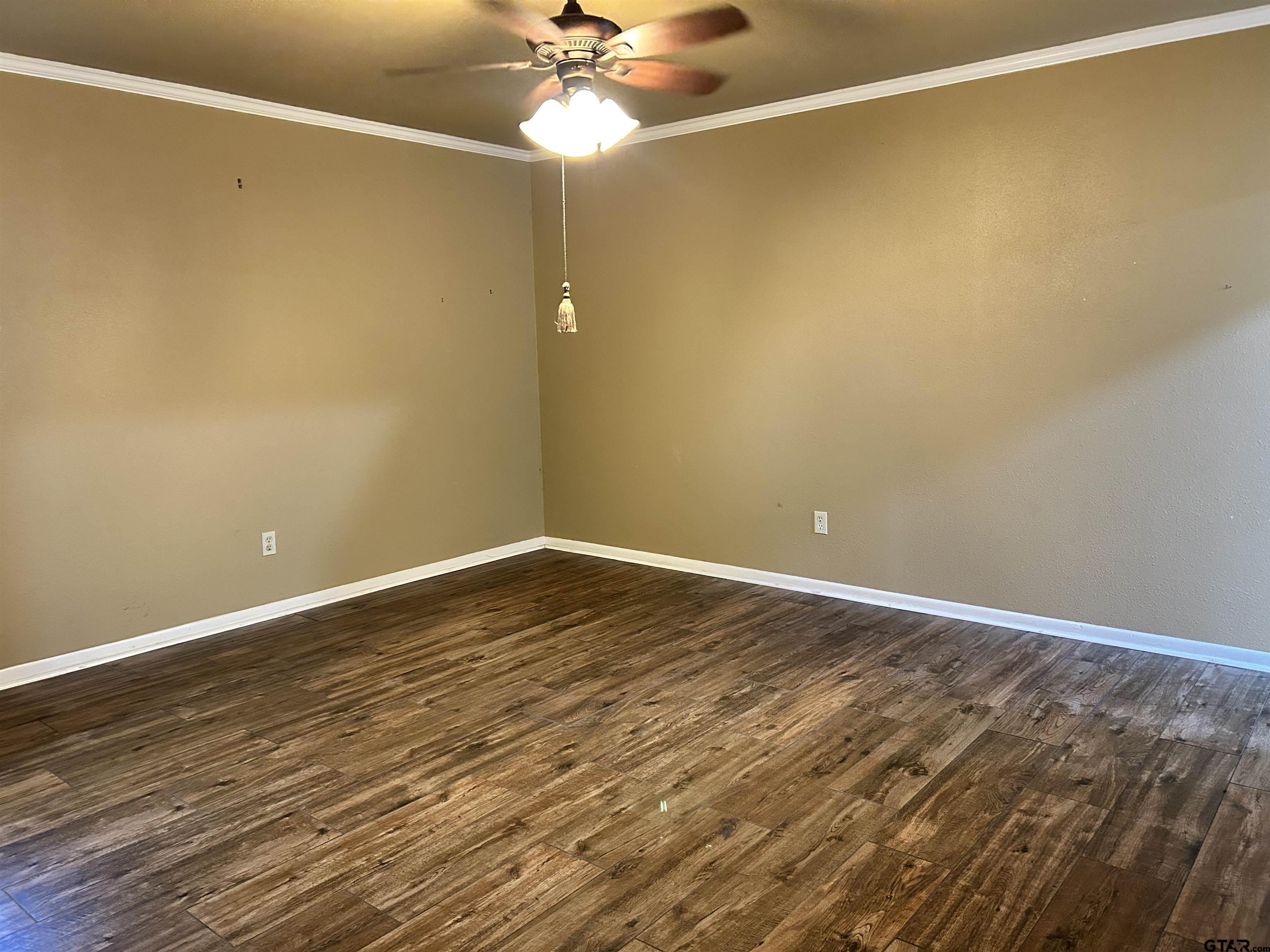 809 David Drive Tyler, TX 75703 - Photo 7 of 18 a view of an empty room with wooden floor