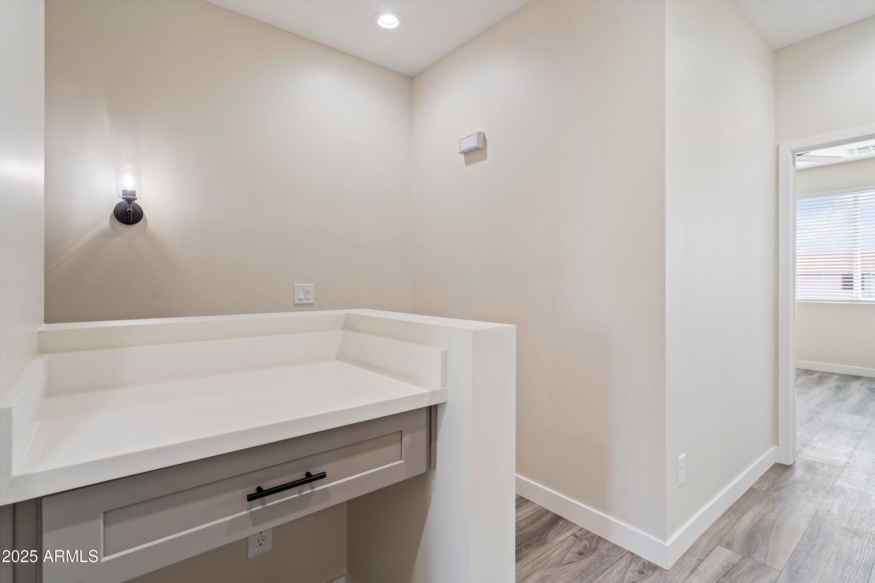 1642 East Monte Vista Road, Unit 1 Phoenix, AZ 85006 - Photo 13 of 34 a view of small space with racks on the wall