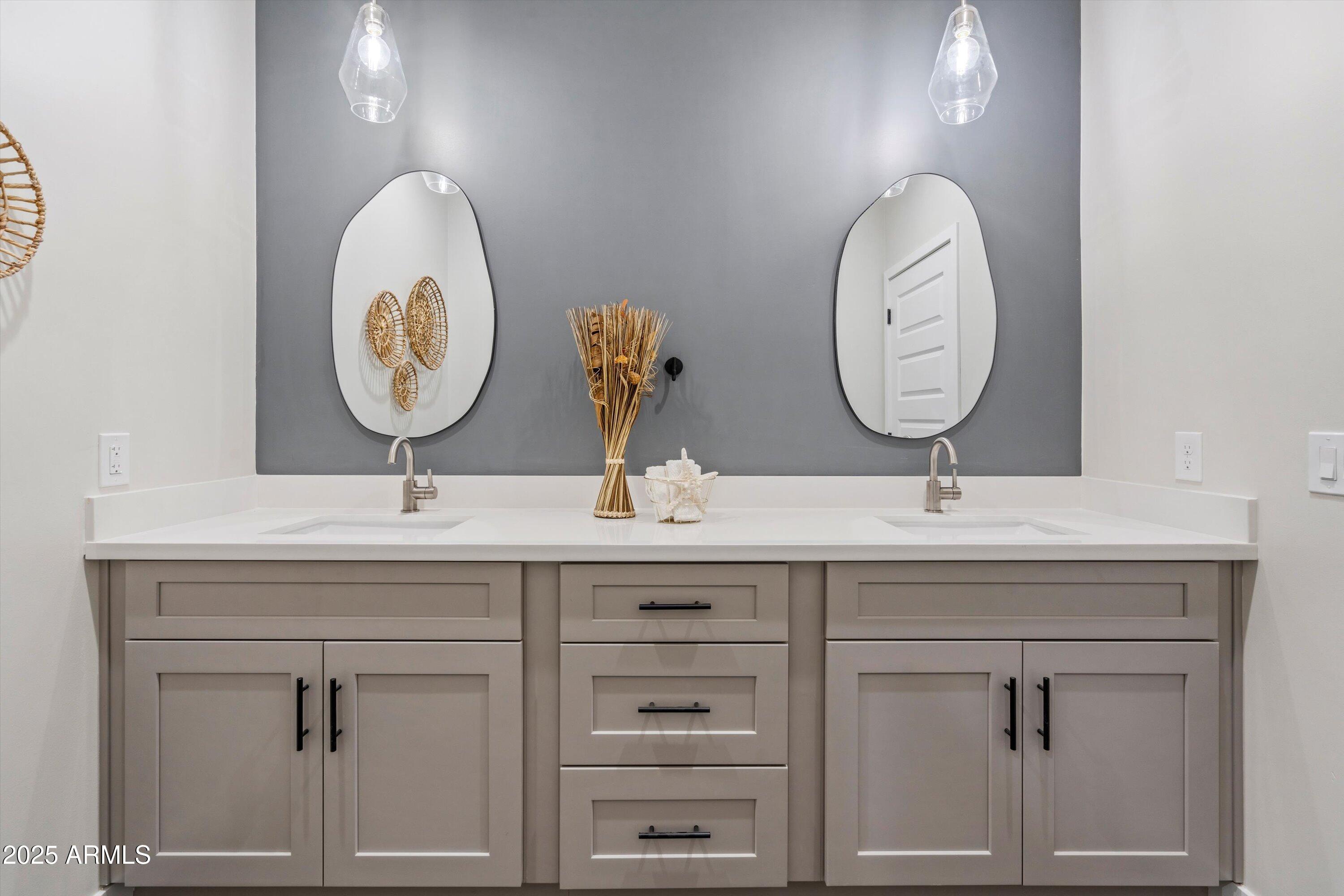 1642 East Monte Vista Road, Unit 1 Phoenix, AZ 85006 - Photo 20 of 34 a bathroom with a sink and a mirror