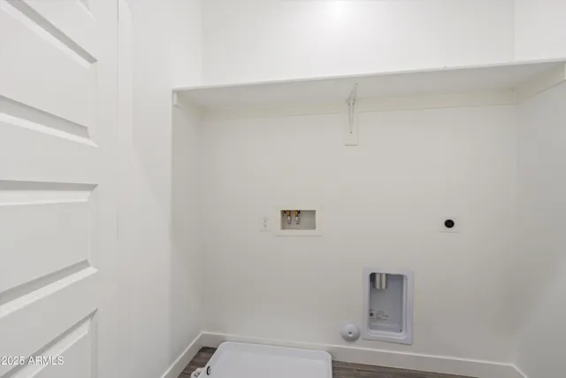 an empty room with a window and a ceiling fan