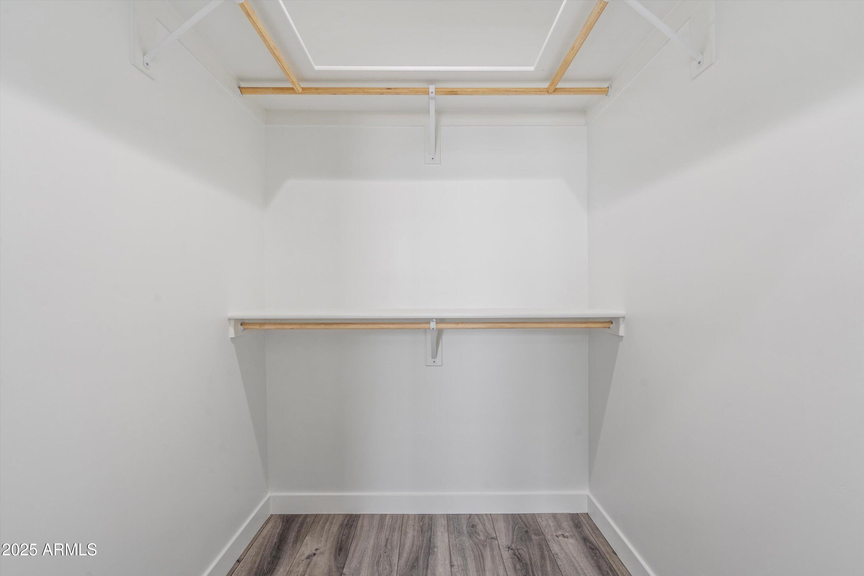 1642 East Monte Vista Road, Unit 1 Phoenix, AZ 85006 - Photo 25 of 34 a view of walk in closet with empty racks