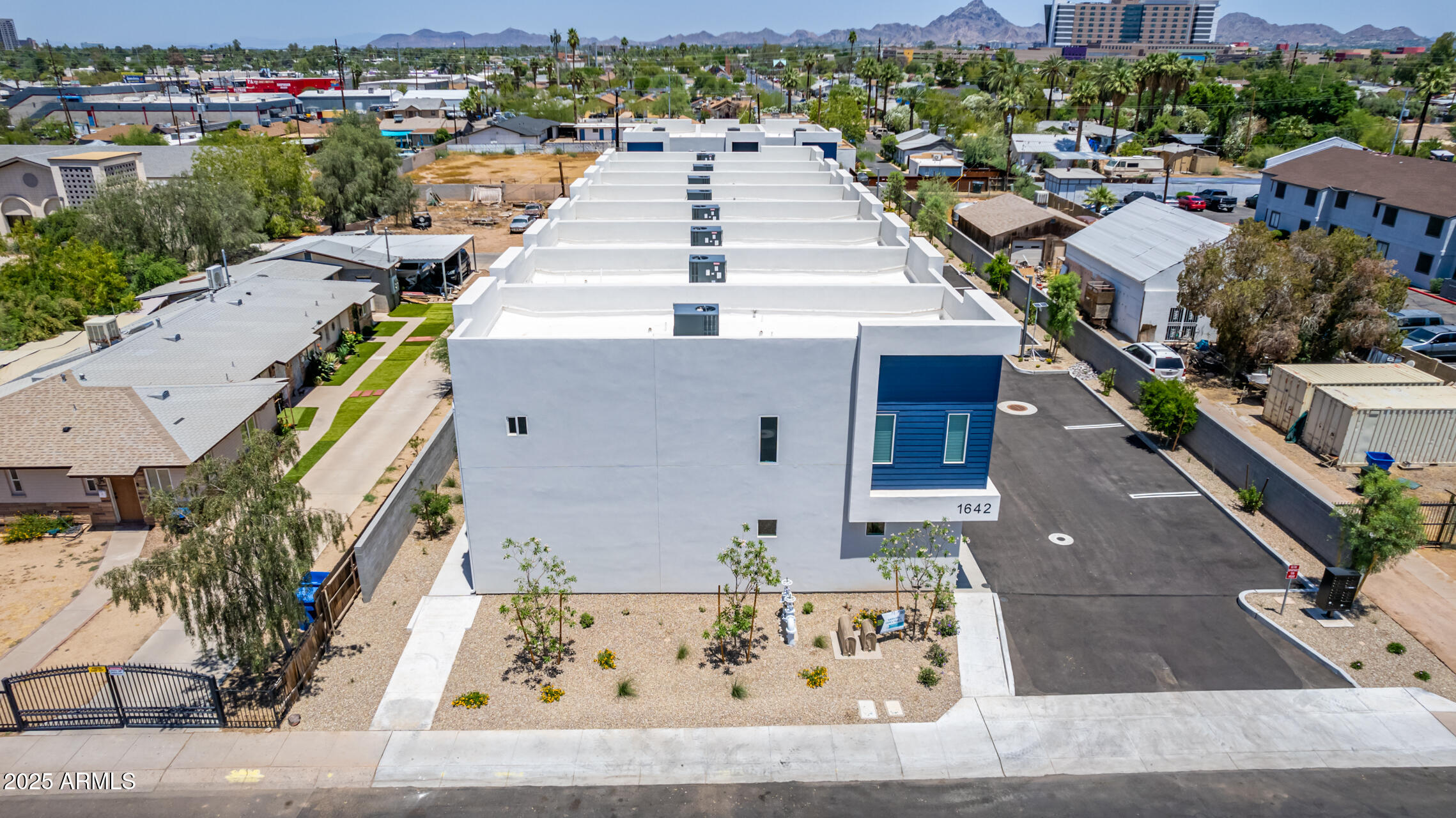 1642 East Monte Vista Road, Unit 1 Phoenix, AZ 85006 - Photo 28 of 34 a picture of houses with outdoor space