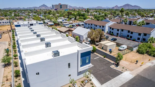 an aerial view of a house with outdoor space