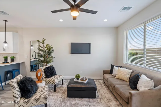 a living room with furniture and a window