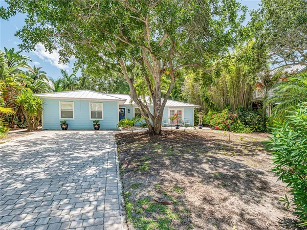 a view of a house with a tree and a tree