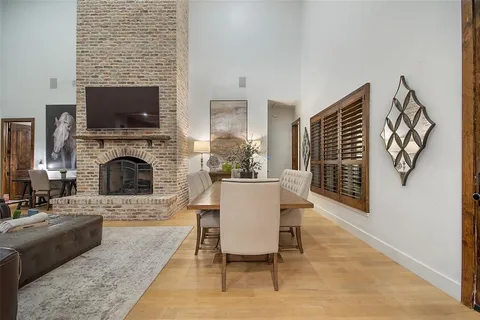 a living room with fireplace furniture and a flat screen tv