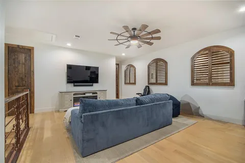 a living room with furniture and a chandelier