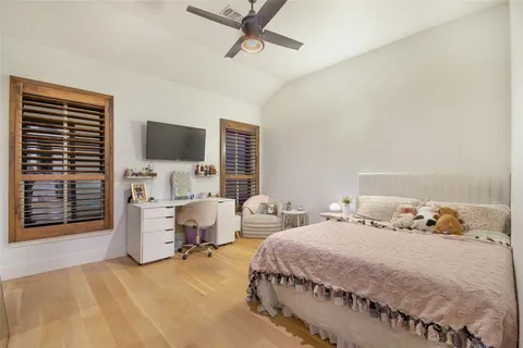 a bedroom with furniture and a window