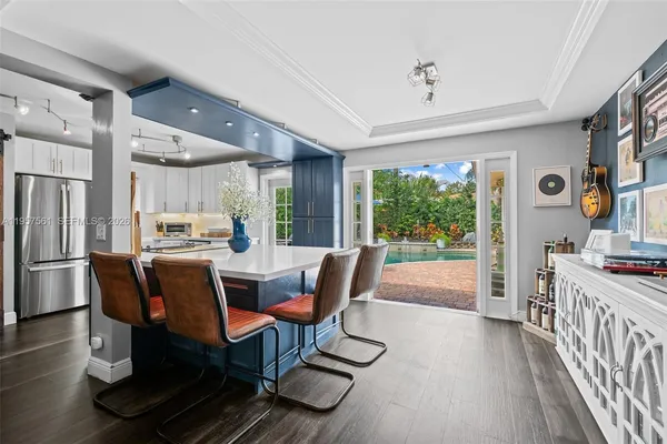 a view of a dining room with furniture window and wooden floor
