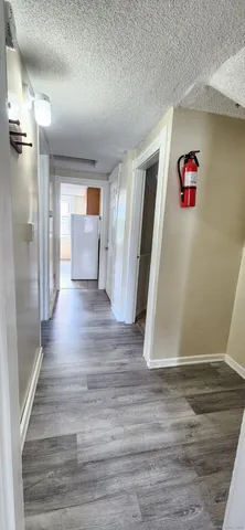 a view of a livingroom with wooden floor
