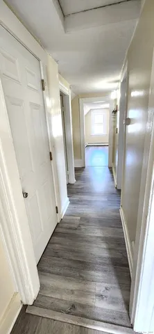 a view of gallery with wooden floor