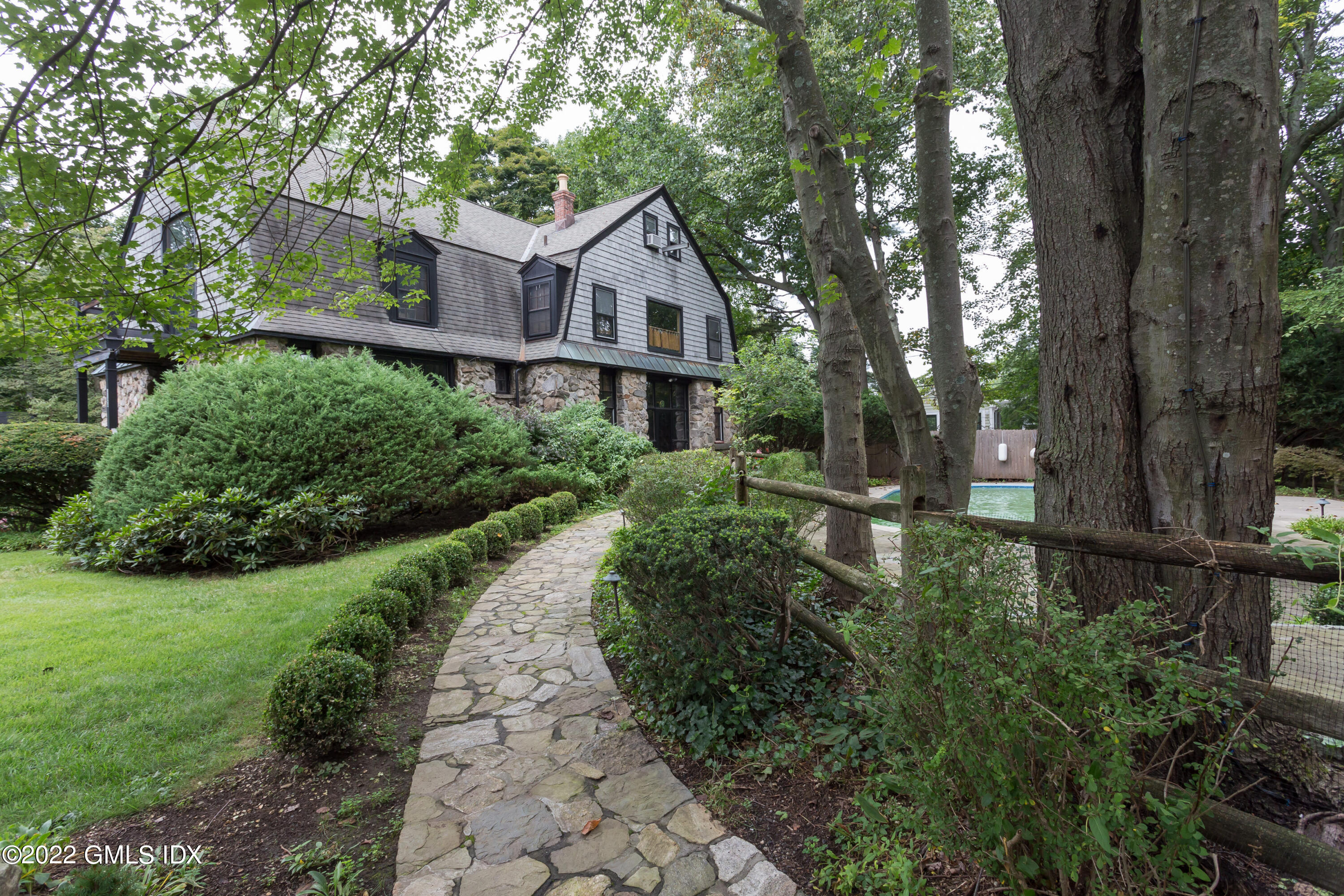 112 Sheep Hill Road Riverside, CT 06878 - Photo 2 of 7 a front view of a house with a yard