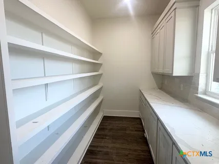 a storage room with wooden floor