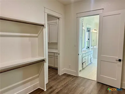 a kitchen with a refrigerator and a sink