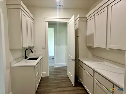 a bathroom with a sink and a window