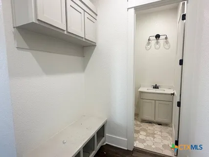 a bathroom with a sink and a mirror