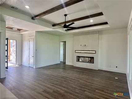 a view of a livingroom with wooden floor