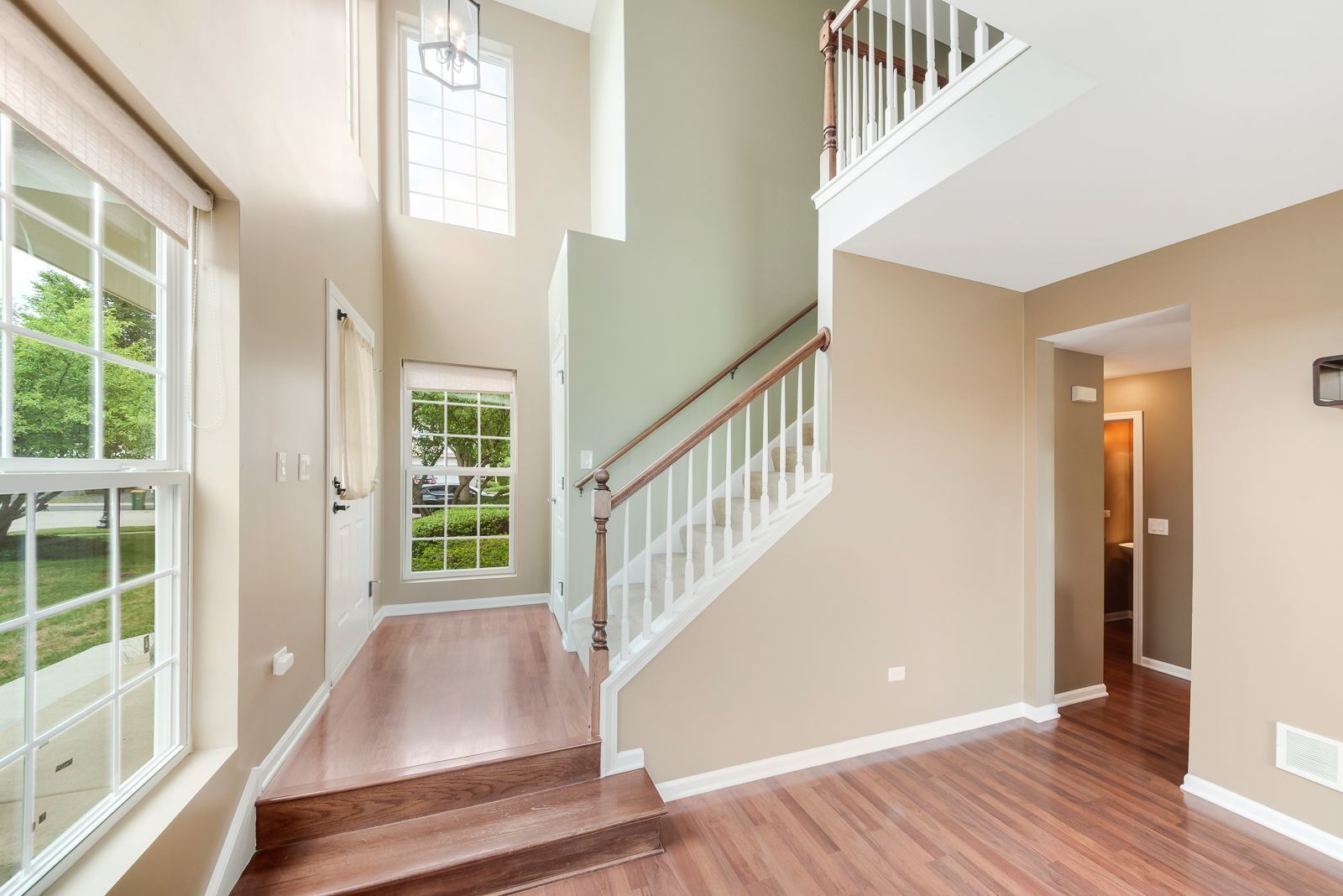15305 Pinewood Road, Unit 15305 Lockport, IL 60441 - Photo 3 of 19 a view of entryway with wooden floor and stairs