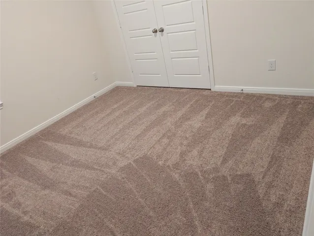 an empty room with cabinet