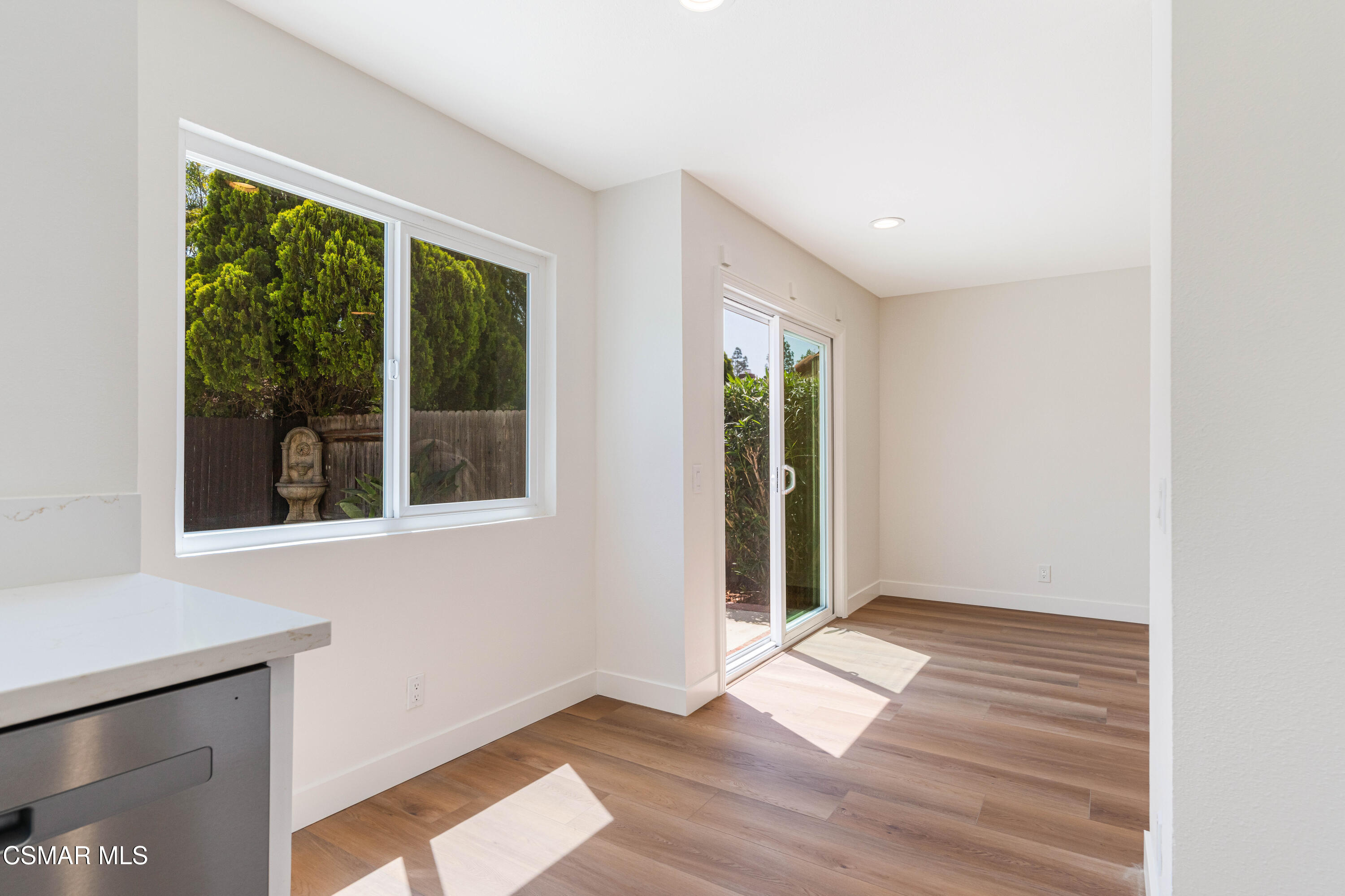 2332 Hampton Avenue Simi Valley, CA 93063 - Photo 12 of 34 an empty room with wooden floor and windows