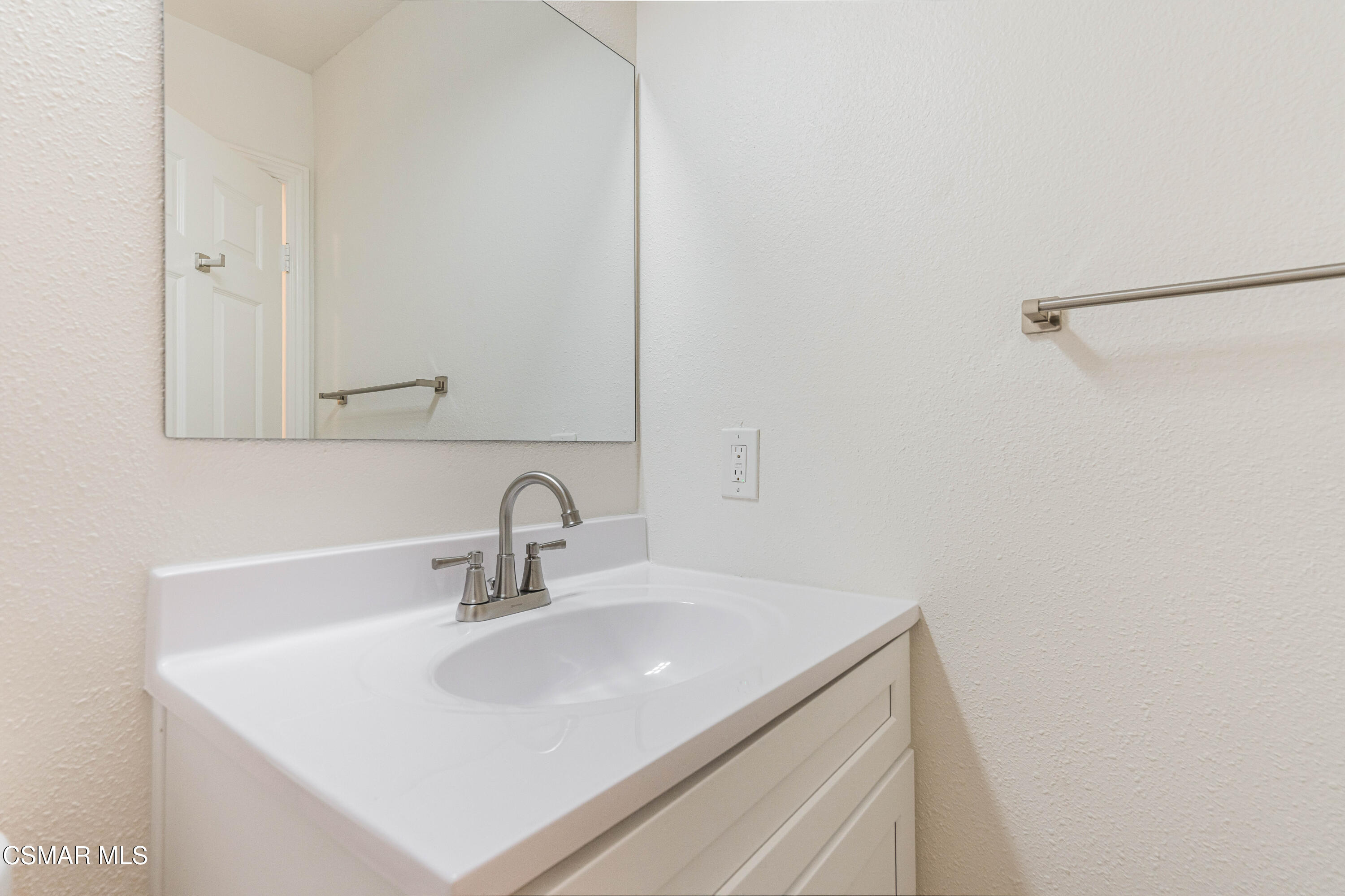 2332 Hampton Avenue Simi Valley, CA 93063 - Photo 16 of 34 a bathroom with a sink and a mirror