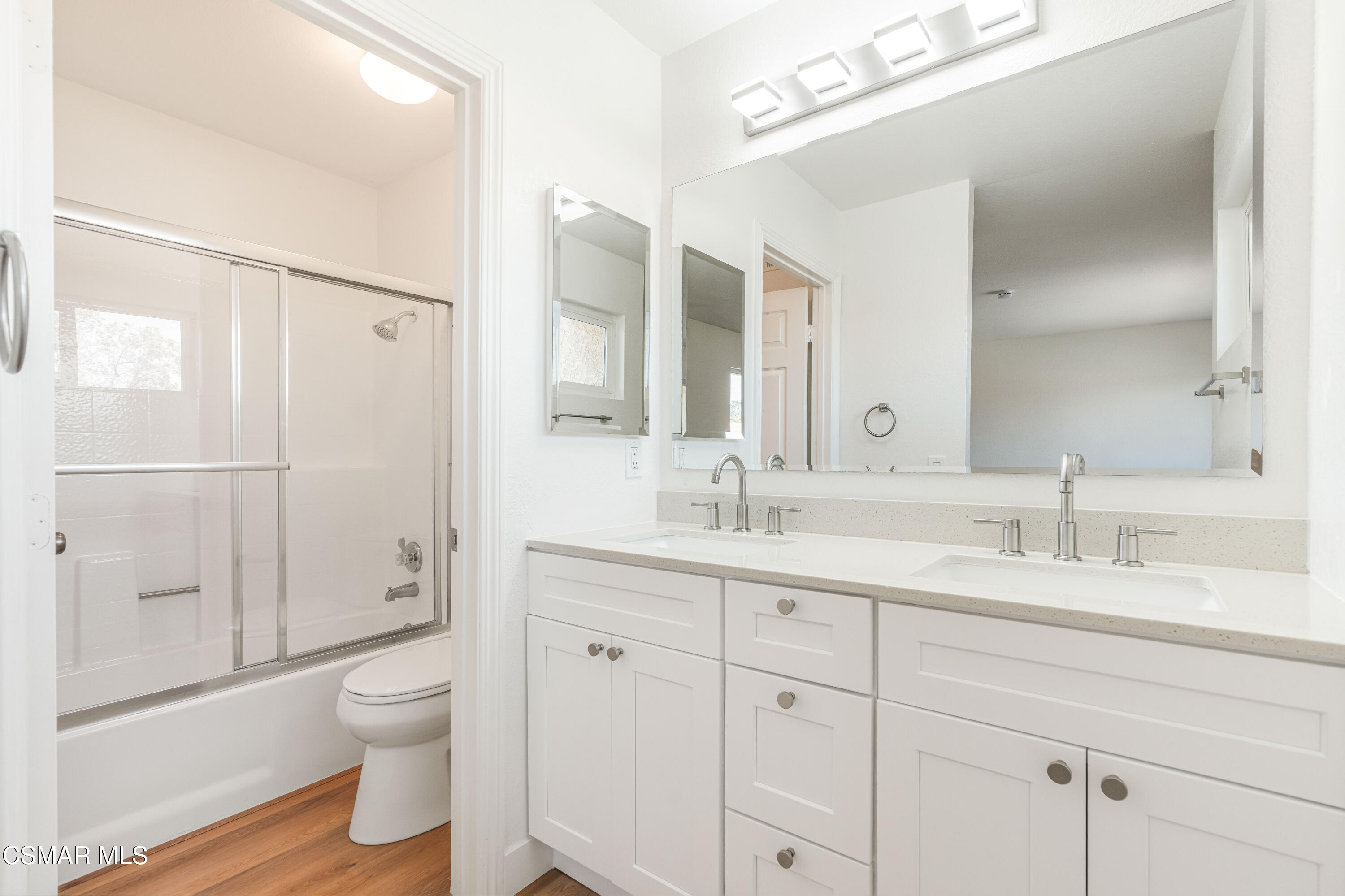 2332 Hampton Avenue Simi Valley, CA 93063 - Photo 21 of 34 a bathroom with a double vanity sink toilet and shower