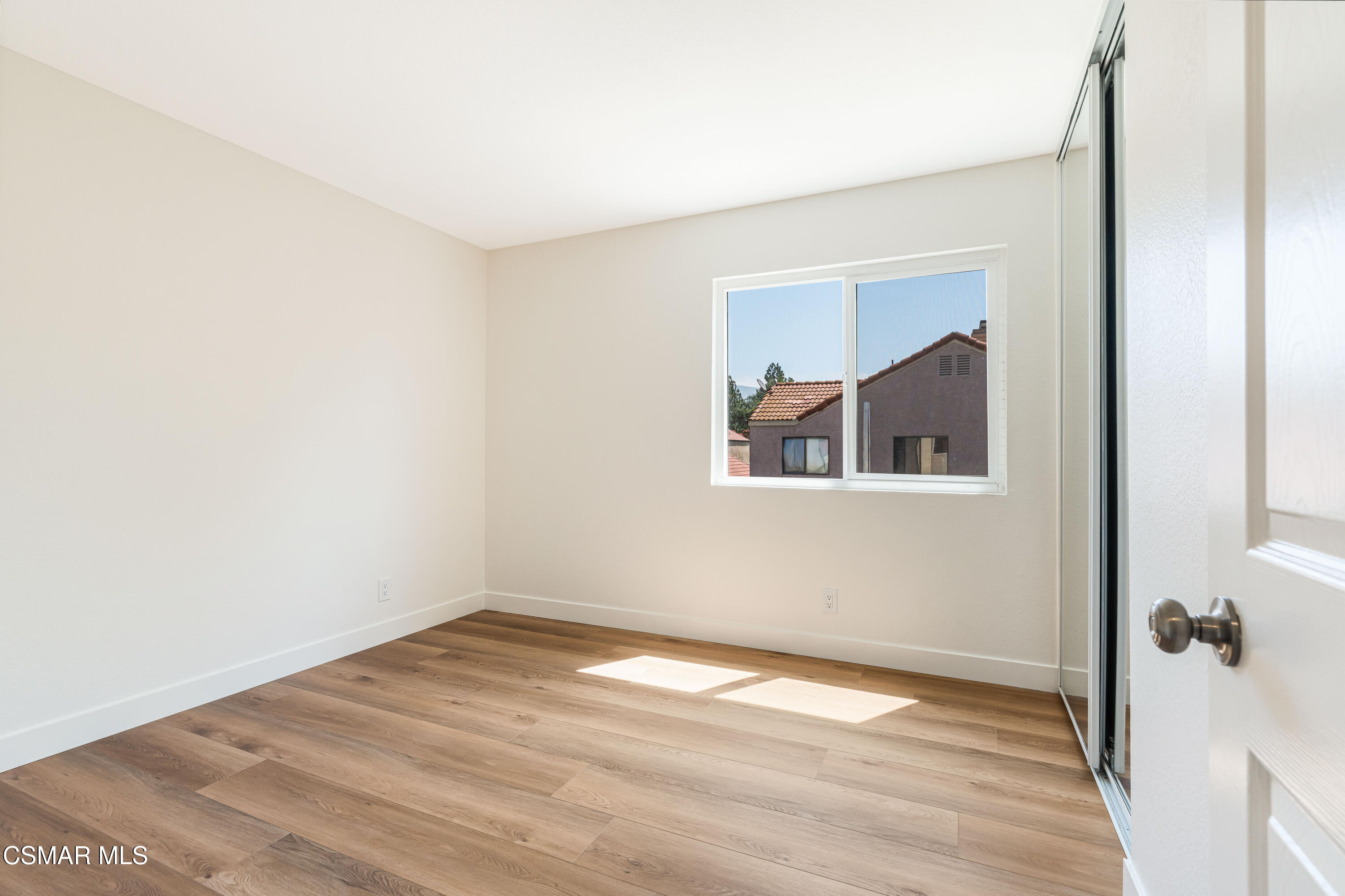 2332 Hampton Avenue Simi Valley, CA 93063 - Photo 25 of 34 a view of empty room with wooden floor and fan