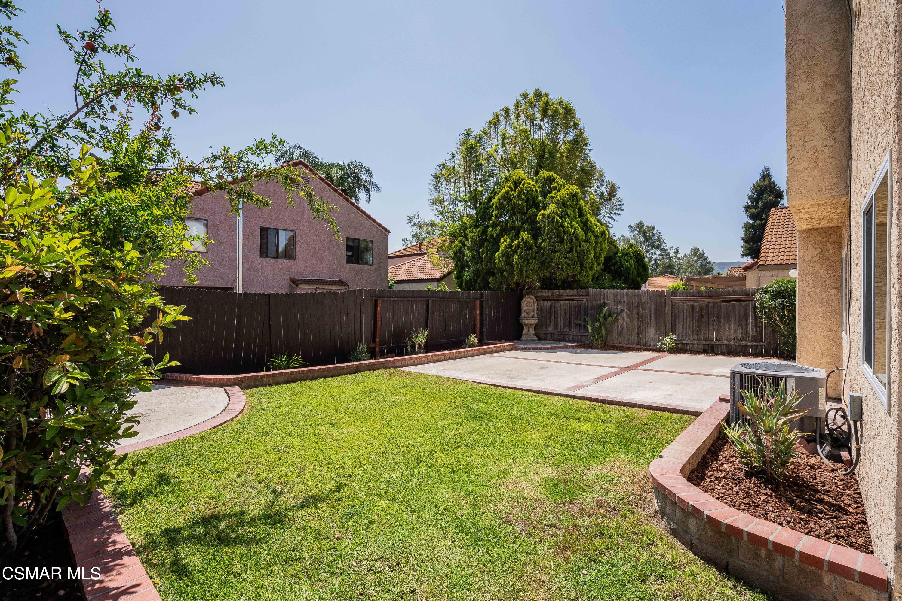 2332 Hampton Avenue Simi Valley, CA 93063 - Photo 30 of 34 a view of a backyard with a tub potted plants and large tree