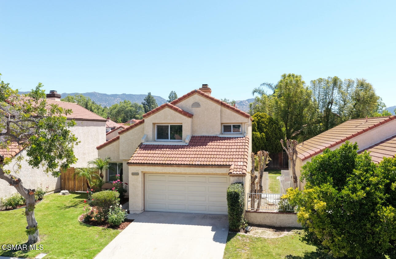 2332 Hampton Avenue Simi Valley, CA 93063 - Photo 33 of 34 a view of a white house with a yard and potted plants