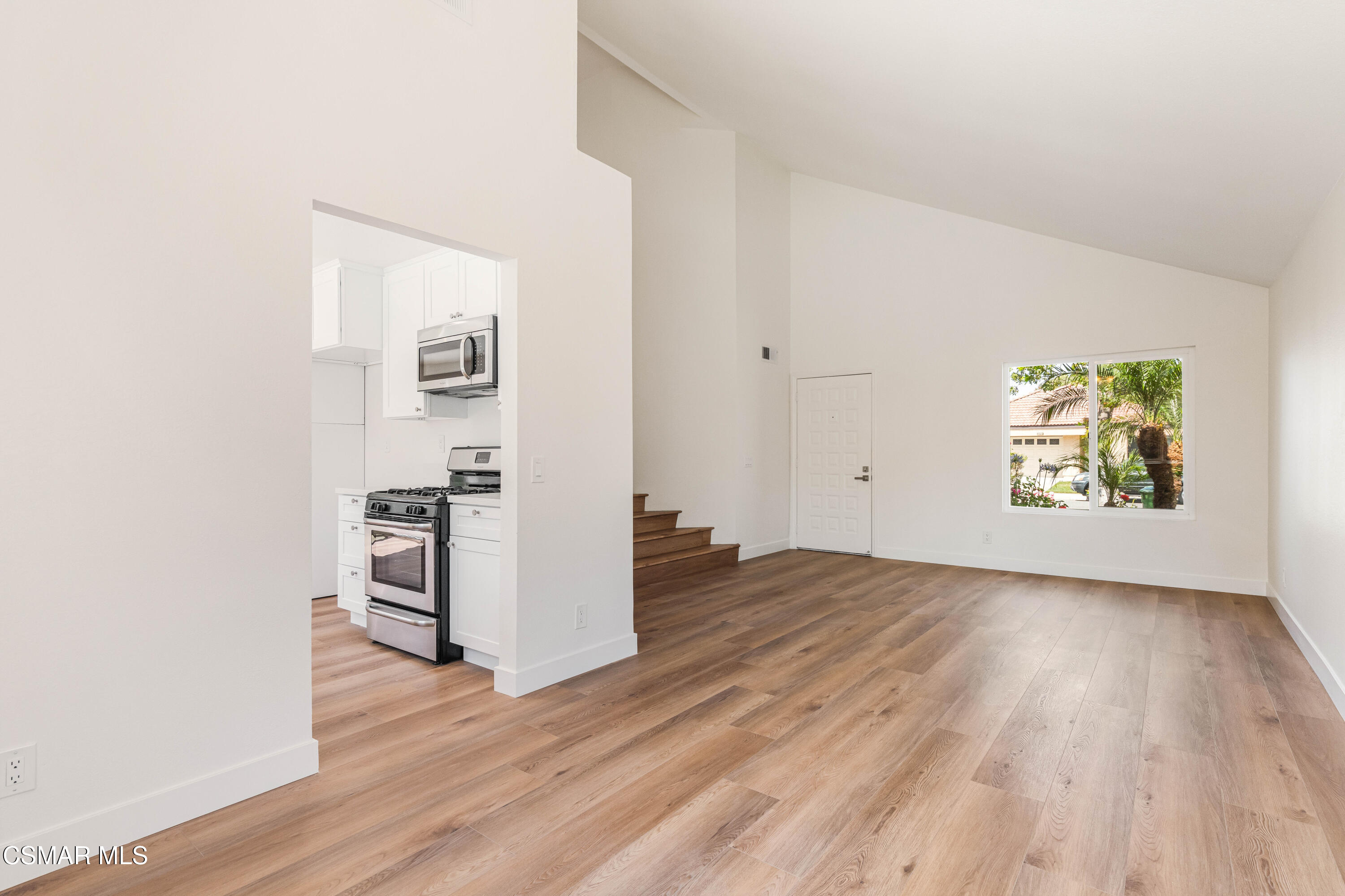 2332 Hampton Avenue Simi Valley, CA 93063 - Photo 7 of 34 an empty room with wooden floor and windows