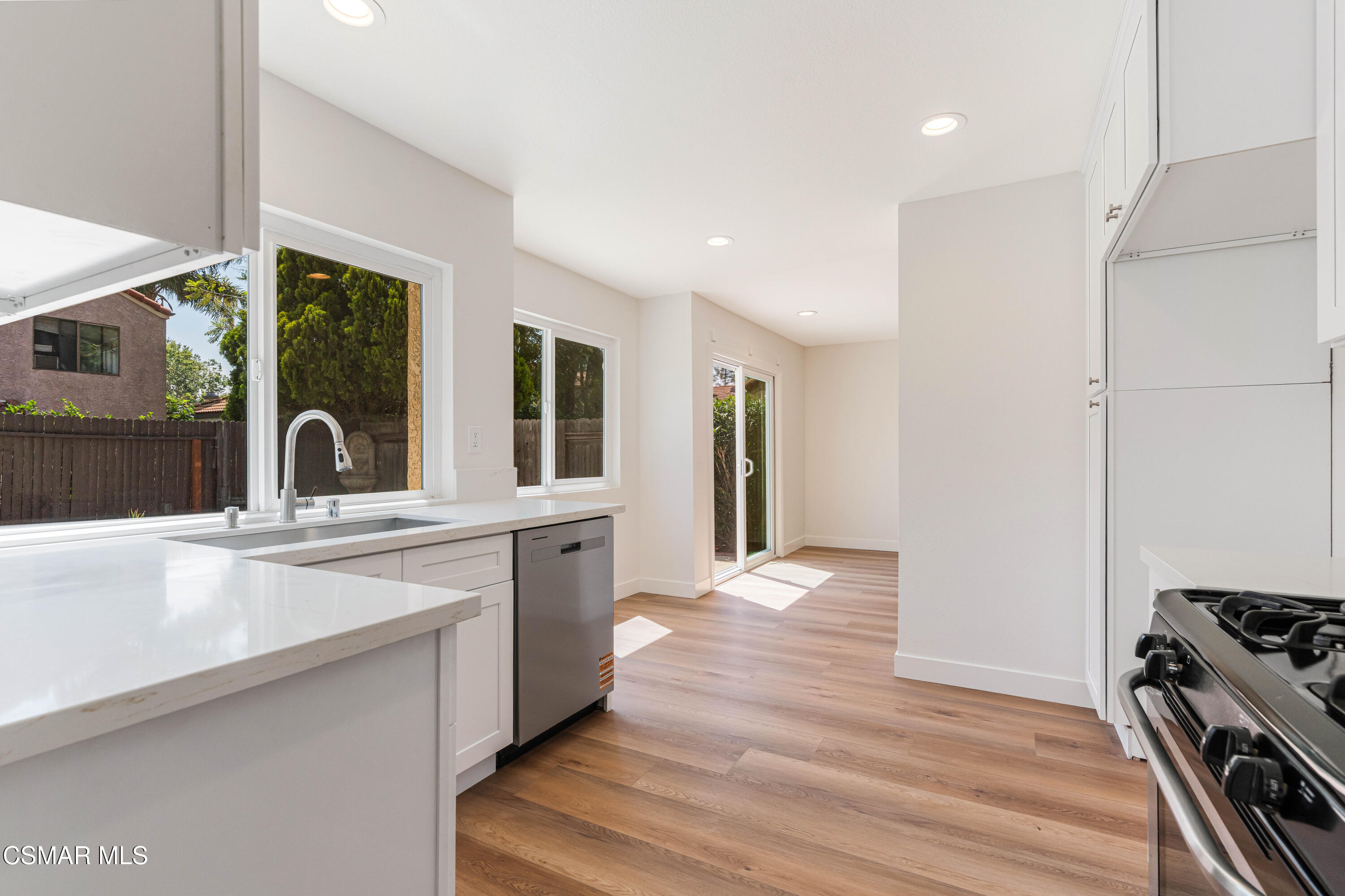 2332 Hampton Avenue Simi Valley, CA 93063 - Photo 8 of 34 a view of a kitchen with a sink and a window