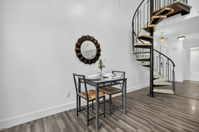 a sitting area with furniture and wooden floor