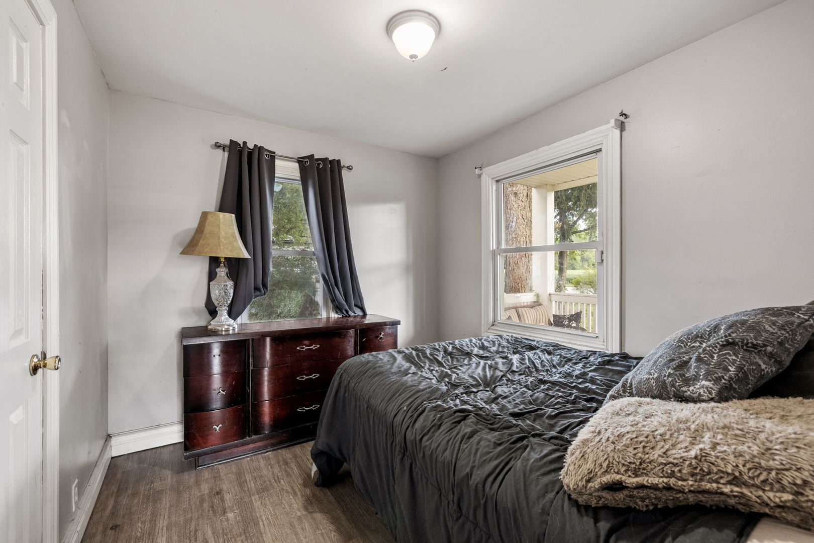 600 Bruce Road Lockport, IL 60441 - Photo 12 of 23 a bedroom with a bed and wooden floor