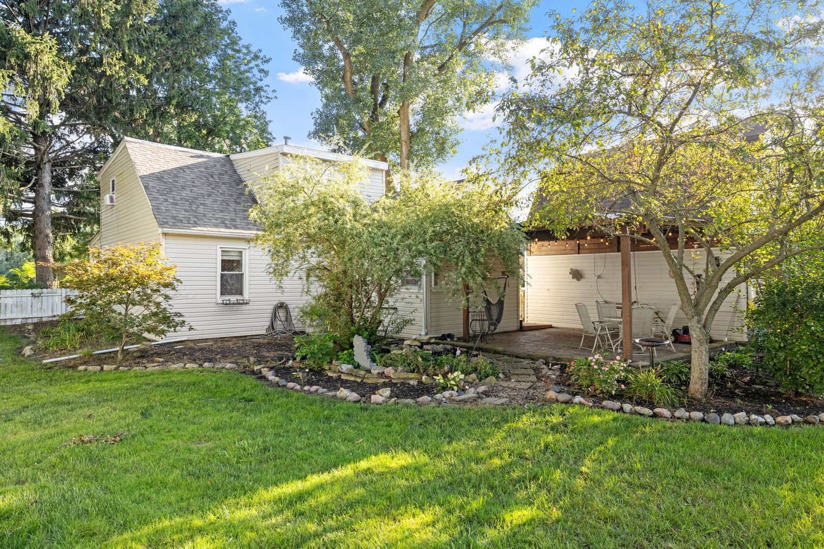 600 Bruce Road Lockport, IL 60441 - Photo 22 of 23 a view of a backyard with plants and large tree