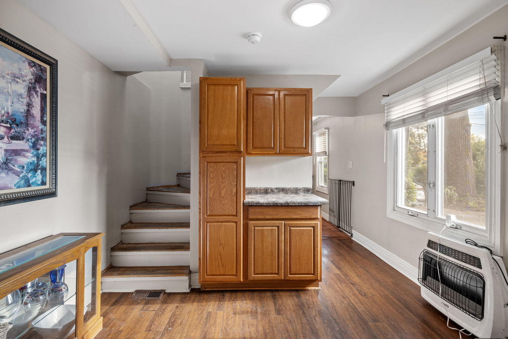 600 Bruce Road Lockport, IL 60441 - Photo 10 of 23 a kitchen with granite countertop wooden floors and stainless steel appliances