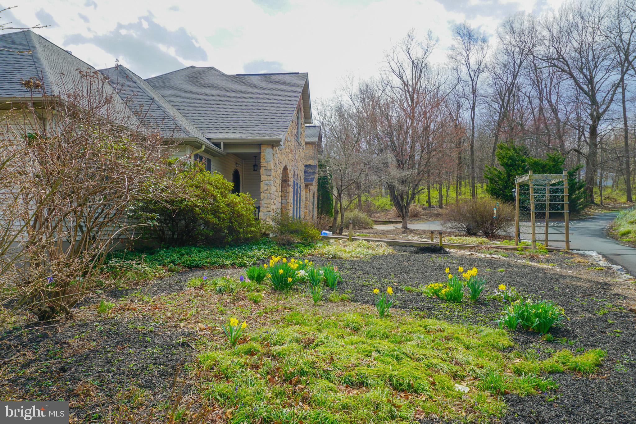 4815 Zeiglers Church Road Spring Grove, PA 17362 - Photo 15 of 126 a view of a brick house with a yard and plants