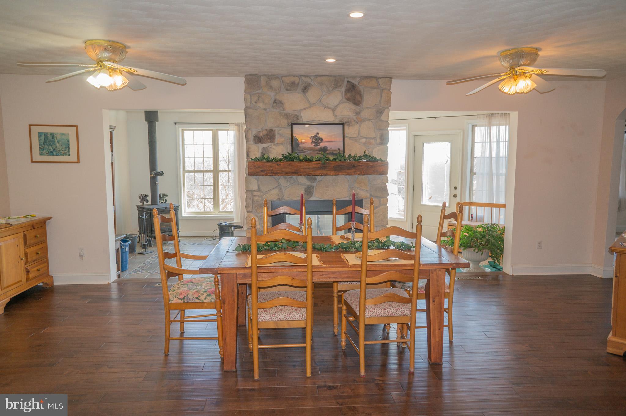 4815 Zeiglers Church Road Spring Grove, PA 17362 - Photo 17 of 126 a view of a dining room with furniture and wooden floor