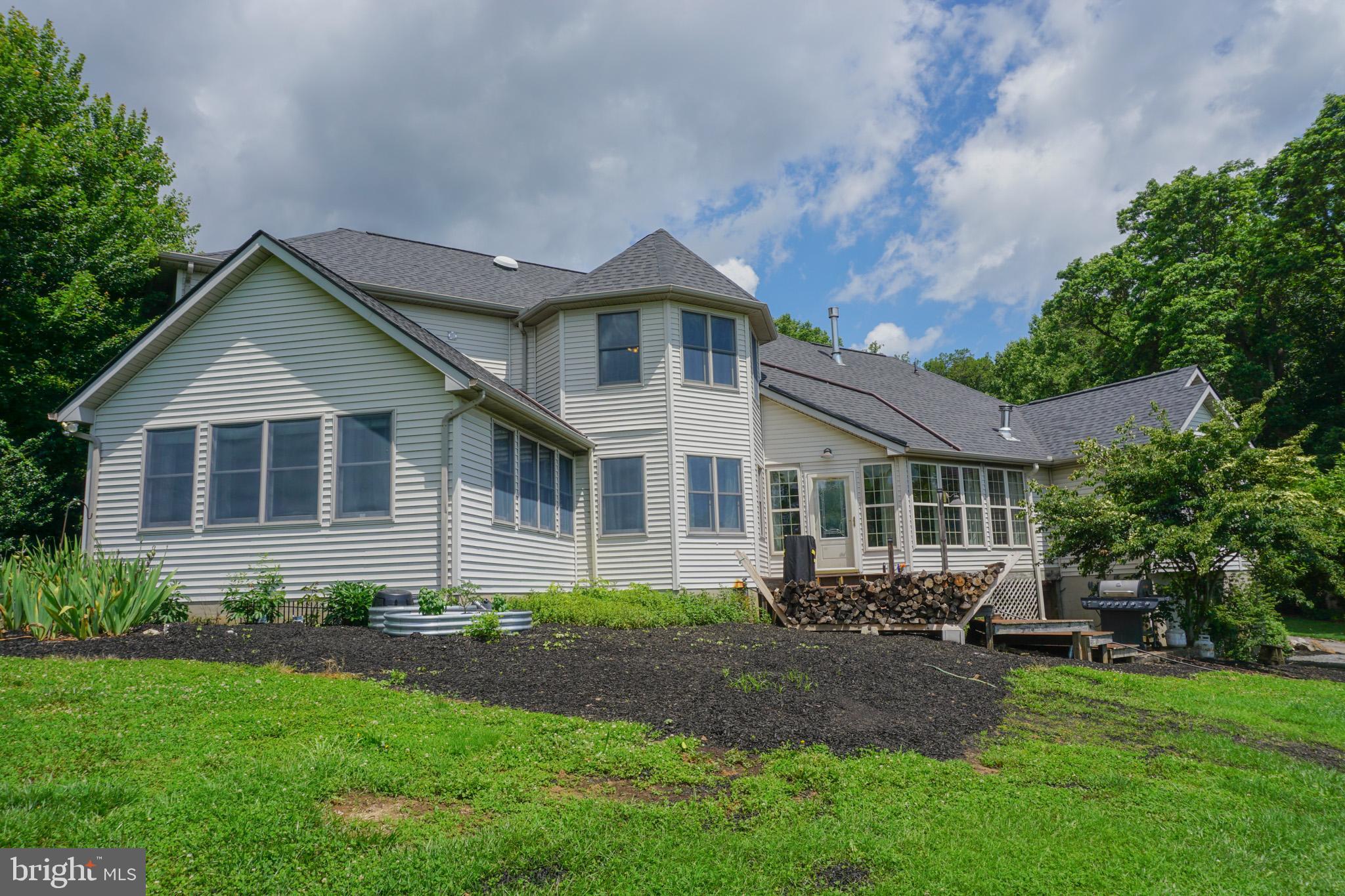 4815 Zeiglers Church Road Spring Grove, PA 17362 - Photo 6 of 126 a front view of a house with a yard and porch