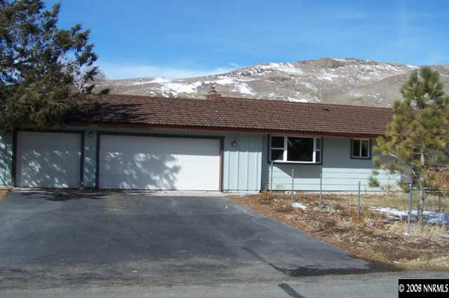 22885 Carriage Drive Reno, NV 89521 - Photo 1 of 5 a front view of a house with a yard